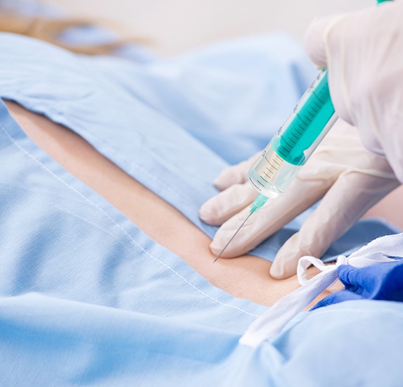 A doctor preparing to inject Vivitrol