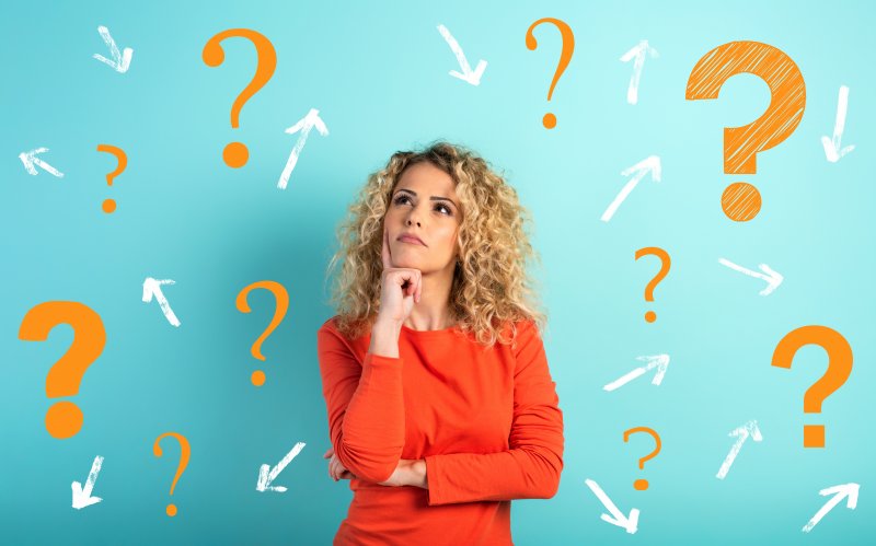 A confused woman considering many questions